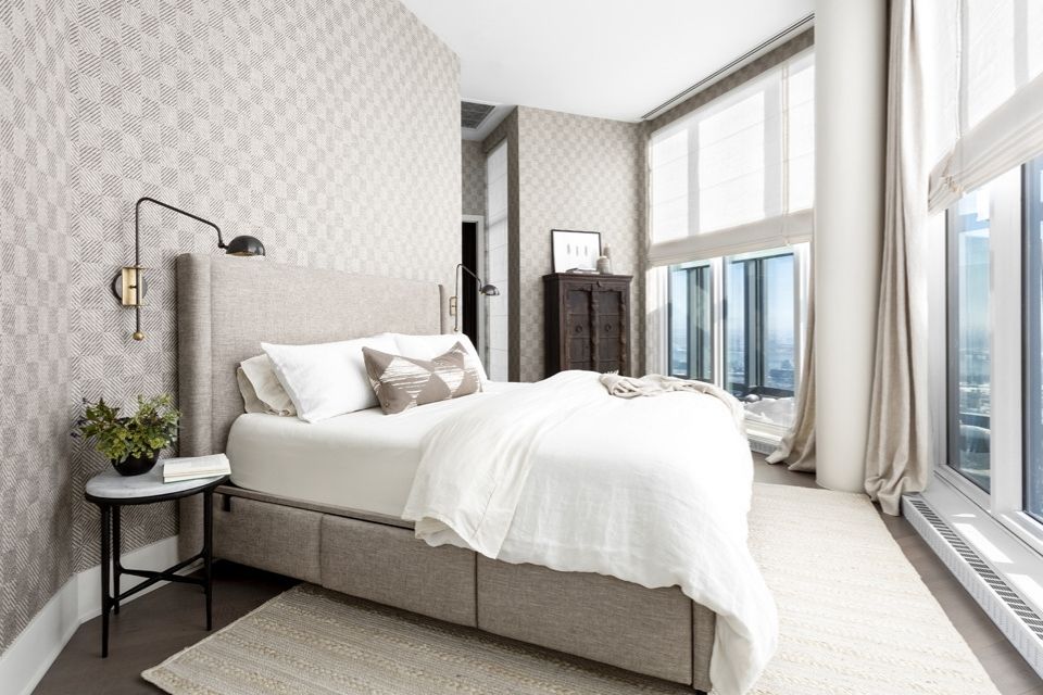 Modern bedroom with wallpaper and view from windows